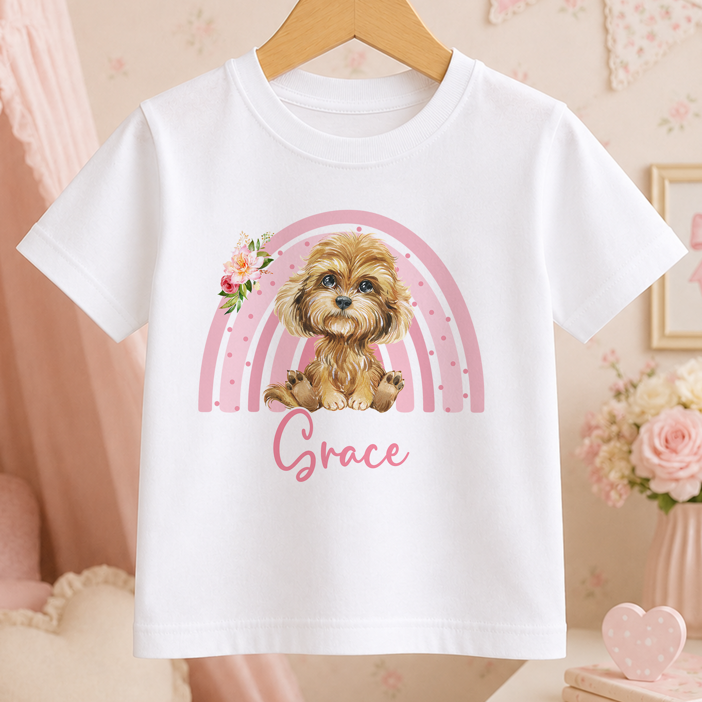A white t-shirt with a printed image of a dog and a rainbow graphic, along with the name "Grace" written below it.