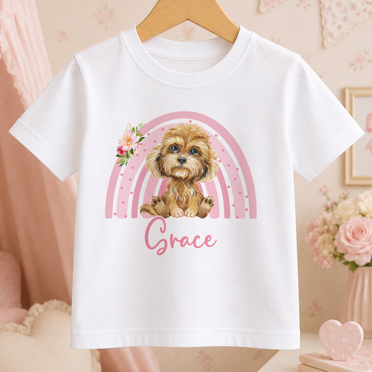 A white t-shirt with a printed image of a dog and a rainbow graphic, along with the name "Grace" written below it.