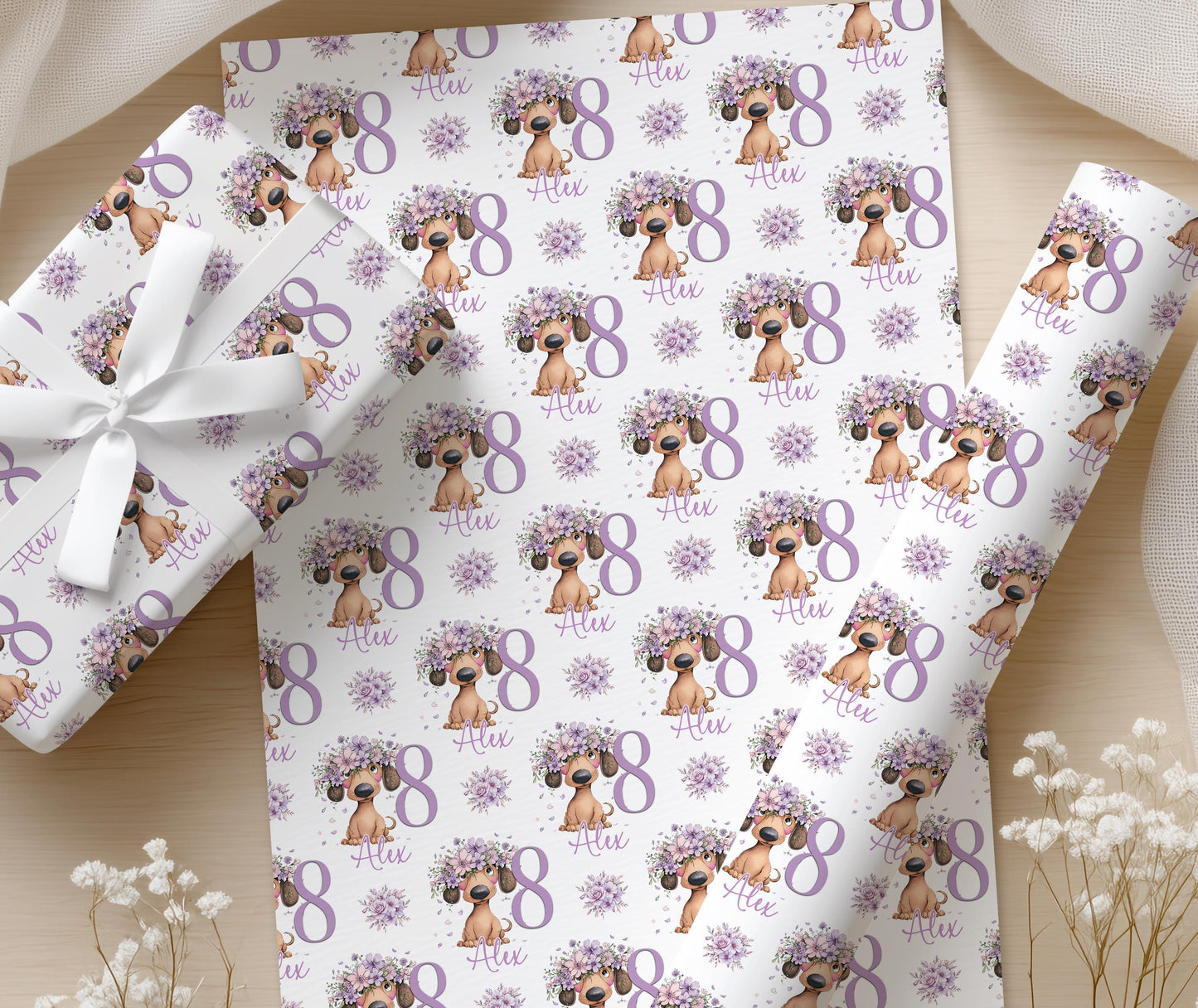 Close-up of hands wrapping a gift box in the personalised lilac floral dachshund wrapping paper.