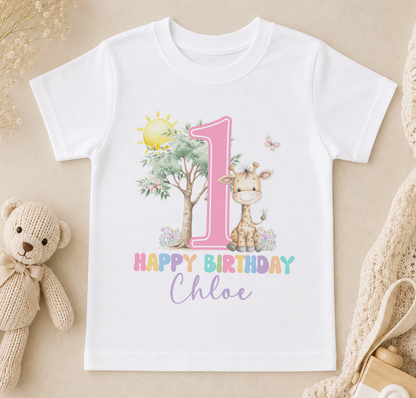 A white t-shirt with a pink number one and a giraffe, along with the text "Happy Birthday Chloe" printed on it.