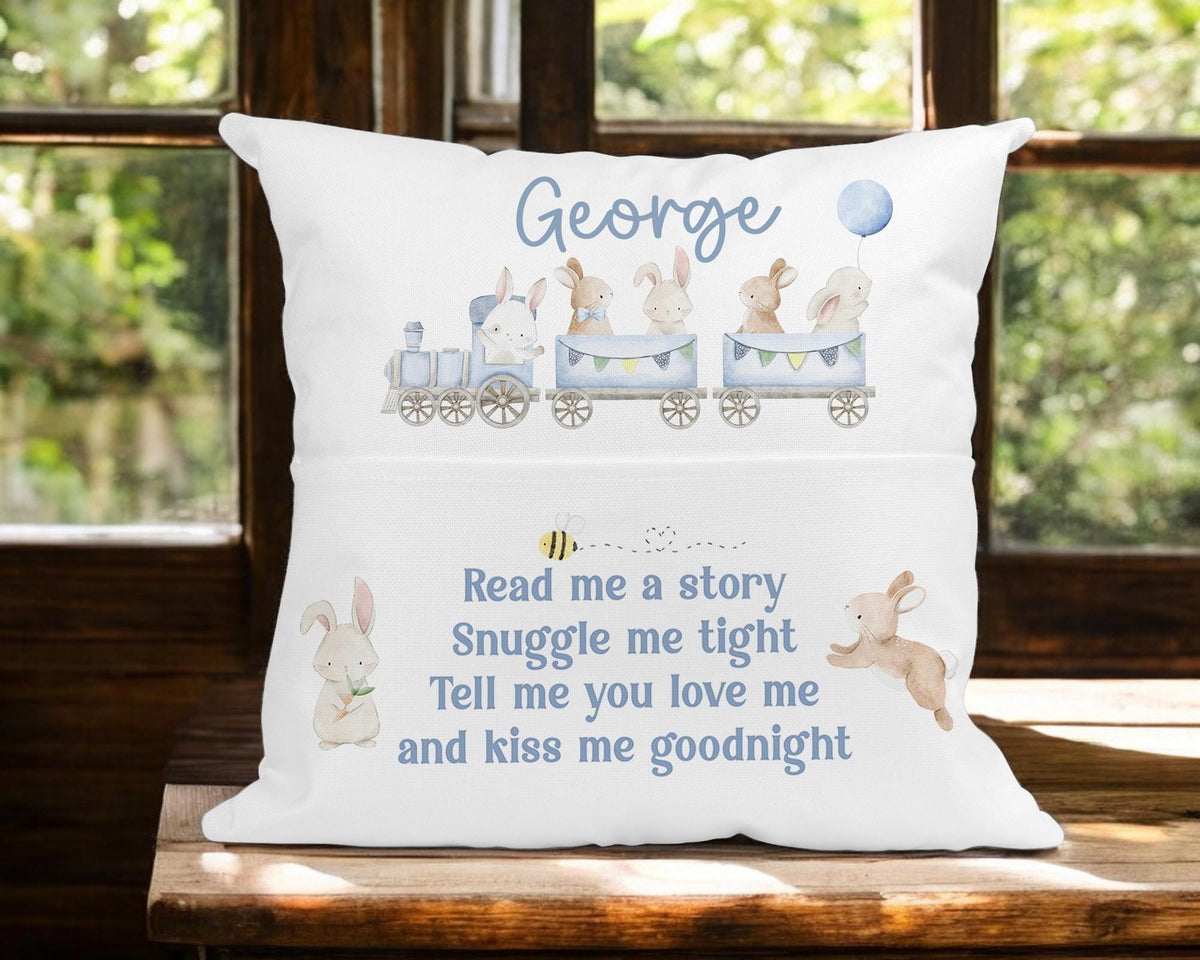 Personalised bedtime story cushion with bunny rabbit and blue train design in a nursery setting