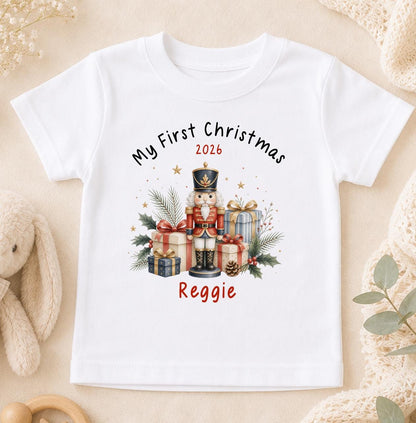 Personalised baby first Christmas t-shirt in white cotton printed with a nutcracker design and baby's name