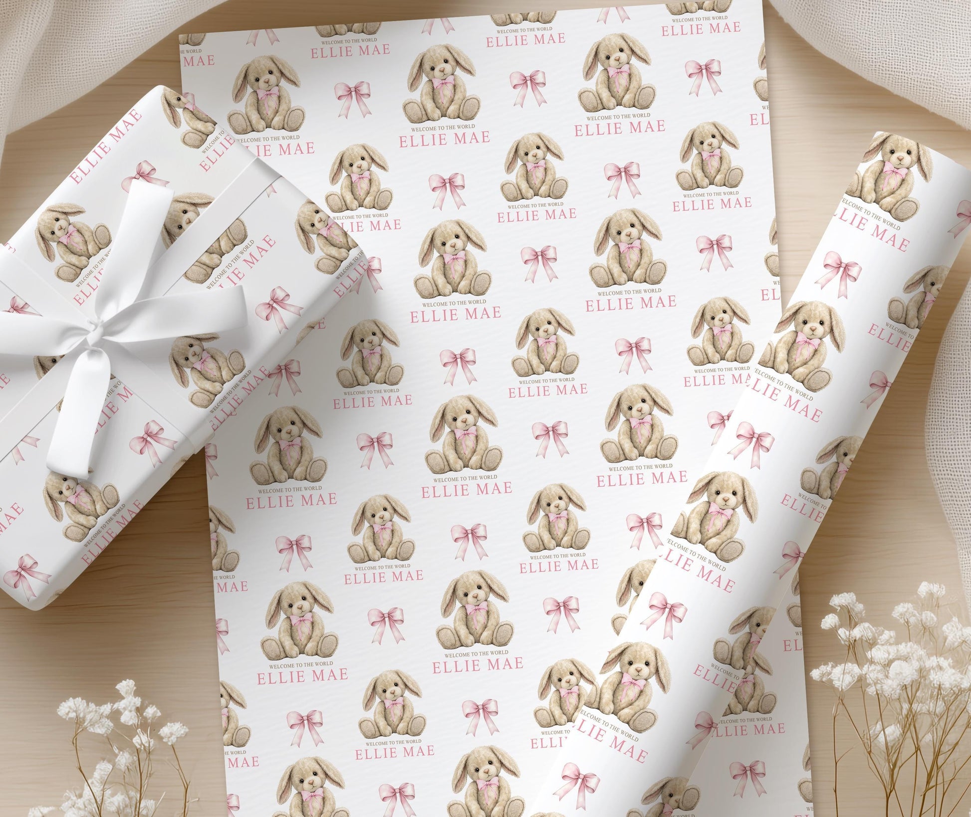 Close-up of the soft pink bunny teddy pattern on the personalised newborn wrapping paper.