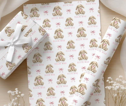 Close-up of the soft pink bunny teddy pattern on the personalised newborn wrapping paper.