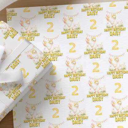 Roll of personalised duck wrapping paper with an example name and age printed on the design