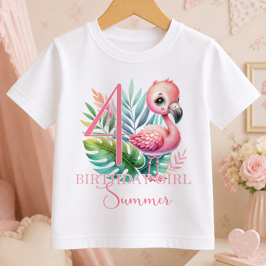 A white t-shirt with a pink flamingo and tropical leaves design, along with the text "4 BIRTHDAY GIRL SUMMER".