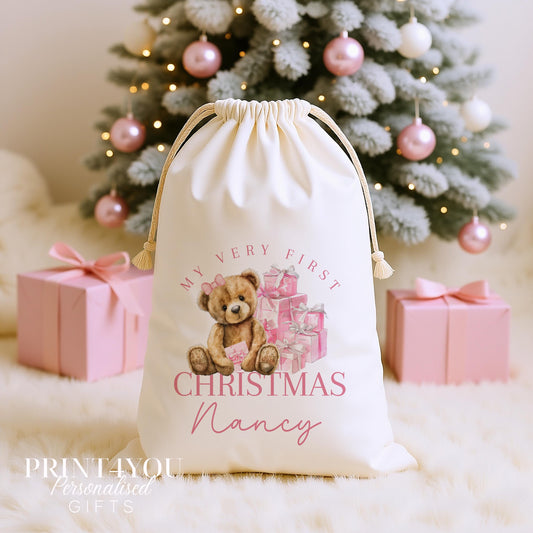 Personalised my first Christmas sack, cream cotton drawstring santa sack printed with a teddy bear and pink presents and My Baby First Christmas with a name