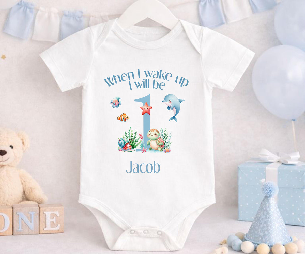 Close-up of the under the sea design personalised with a child's name in soft script.