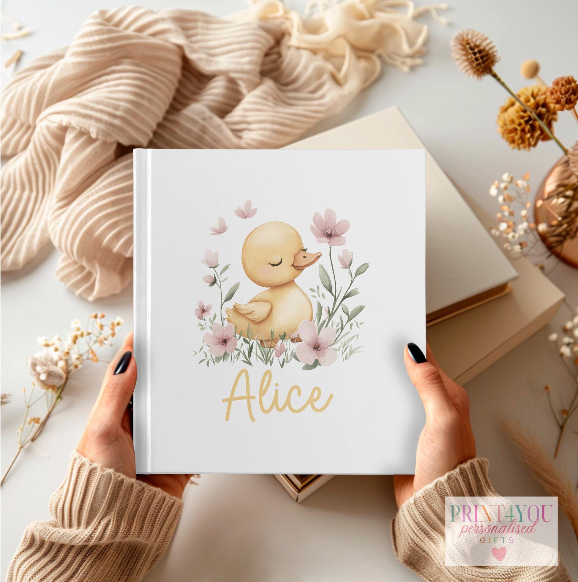 Personalised custom baby keepsake photo album with elegant cover design showing baby's name and birth date