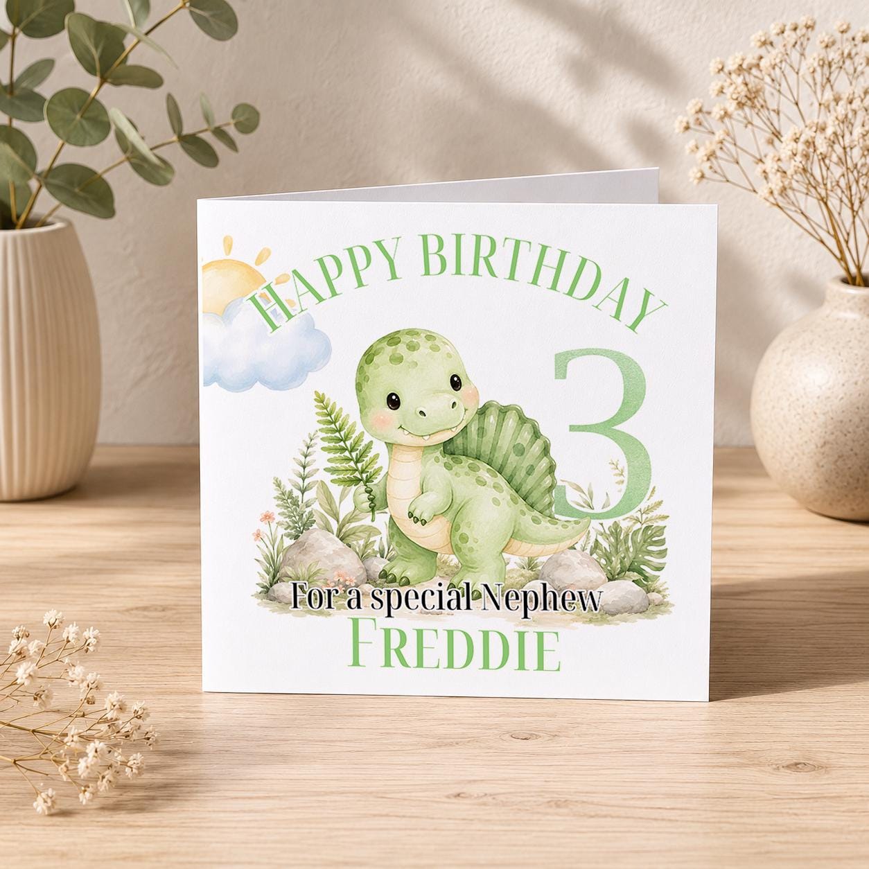 Square greeting card showing the dinosaur birthday card design