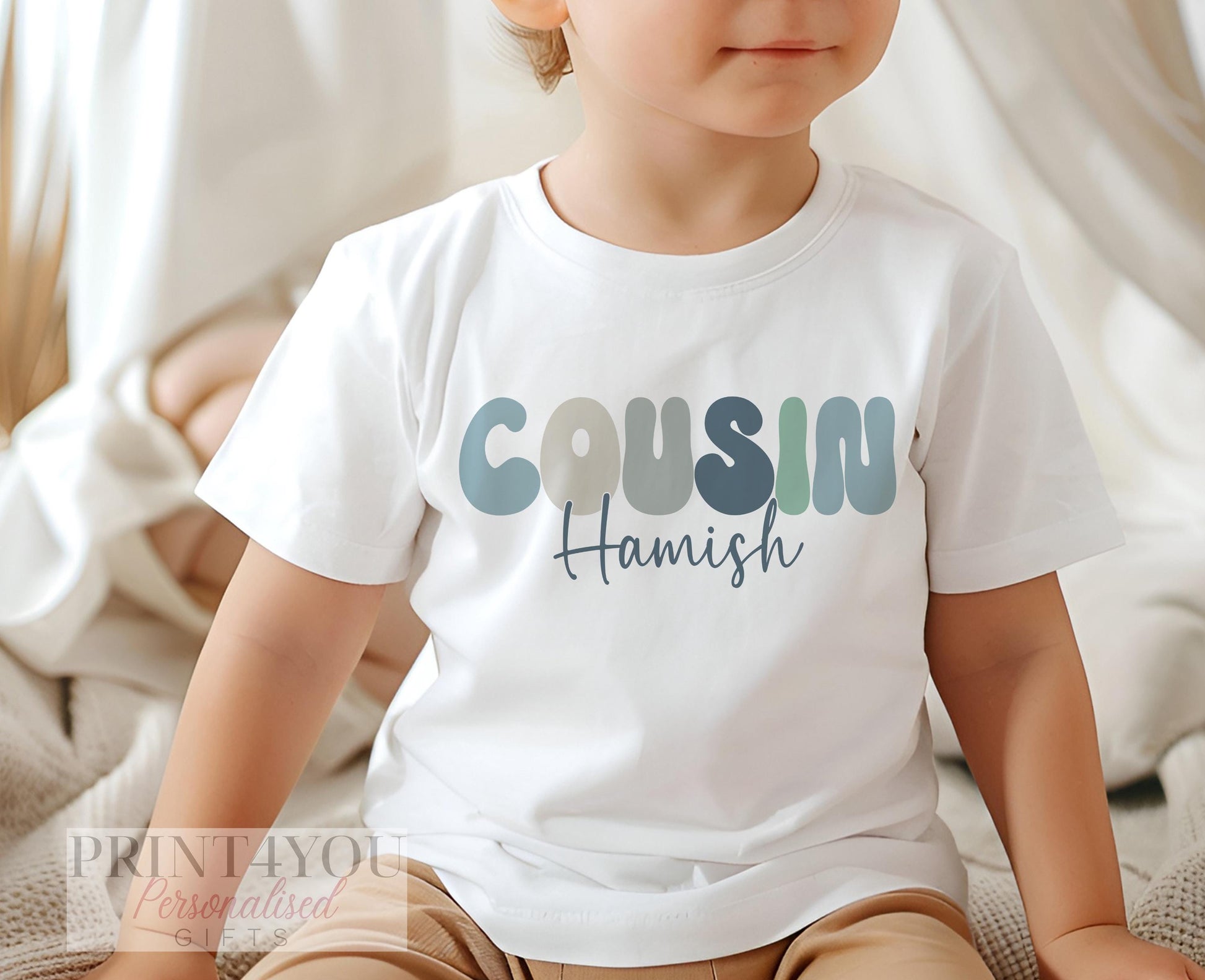 Personalised cousin t-shirt laid flat showing the custom name design