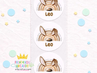 Sheet of round glossy bunny birthday stickers printed with a child's name, boho pastel design