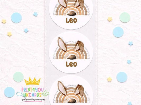 Sheet of round glossy bunny birthday stickers printed with a child's name, boho pastel design