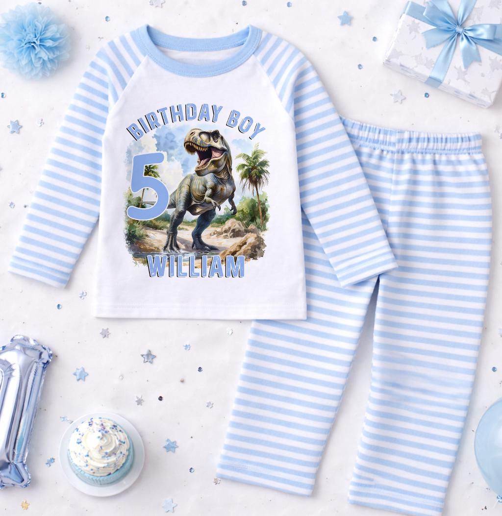 Blue and white striped pyjama set printed with a dinosaur design and personalised name