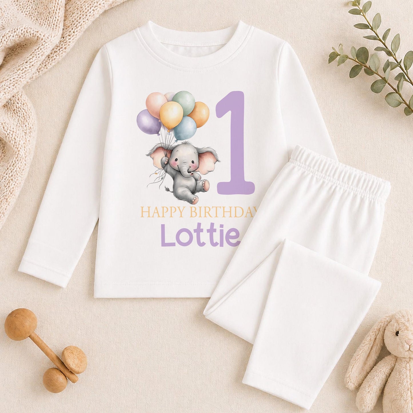 Personalised purple elephant 1st birthday pyjamas with the child's name printed on soft cotton
