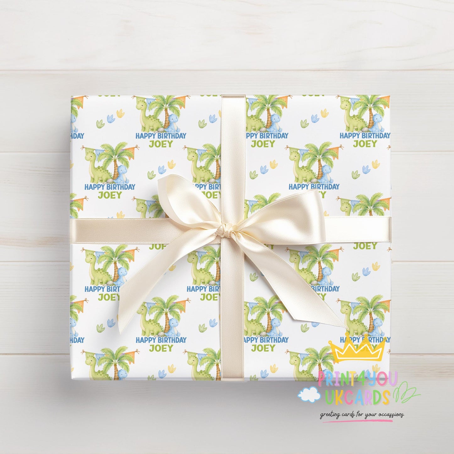 Roll of personalised dinosaur wrapping paper packaged in a postal tube ready for delivery.