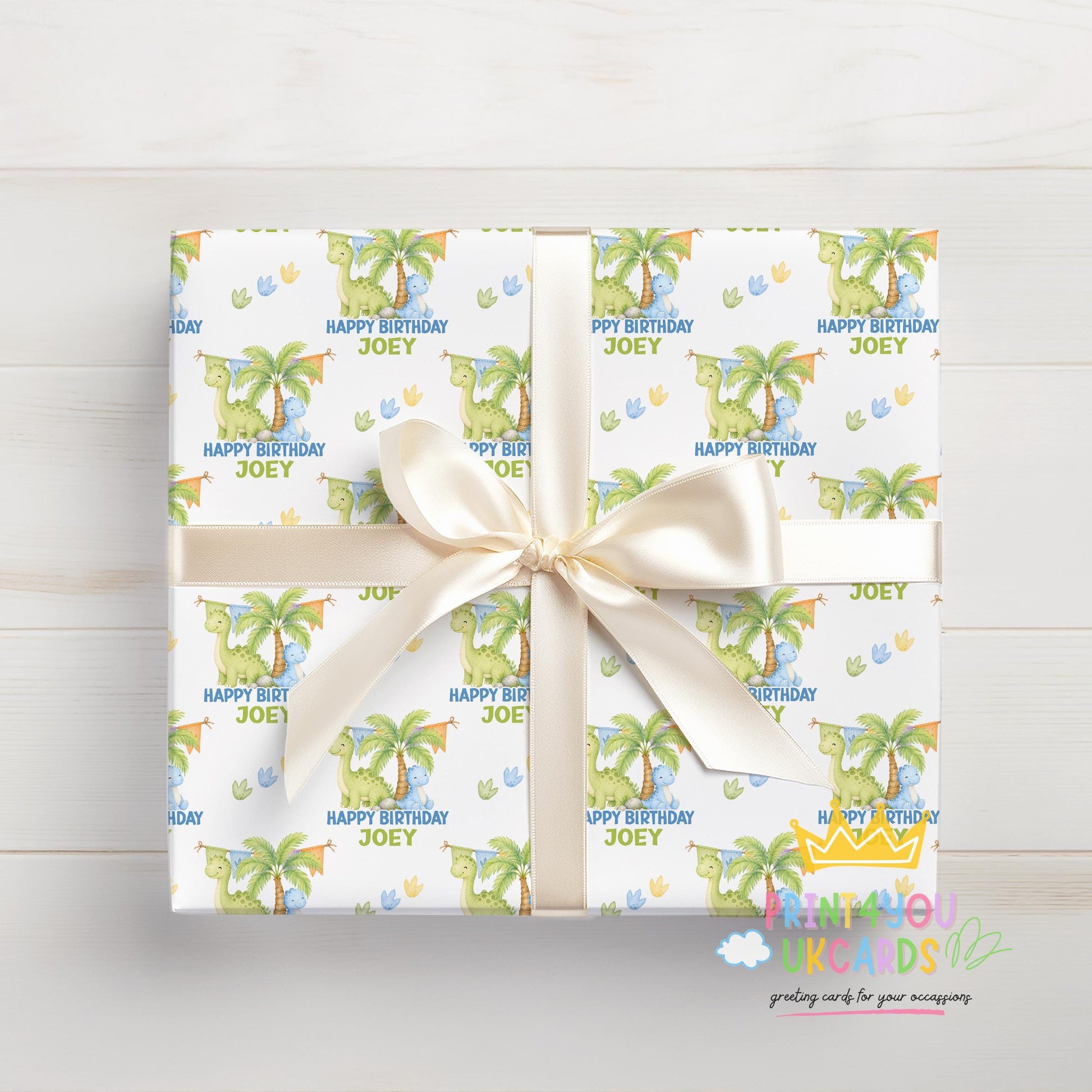 Roll of personalised dinosaur wrapping paper packaged in a postal tube ready for delivery.