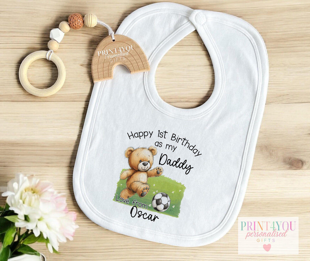 Teddy bear football first birthday vest personalised with baby's name, laid flat