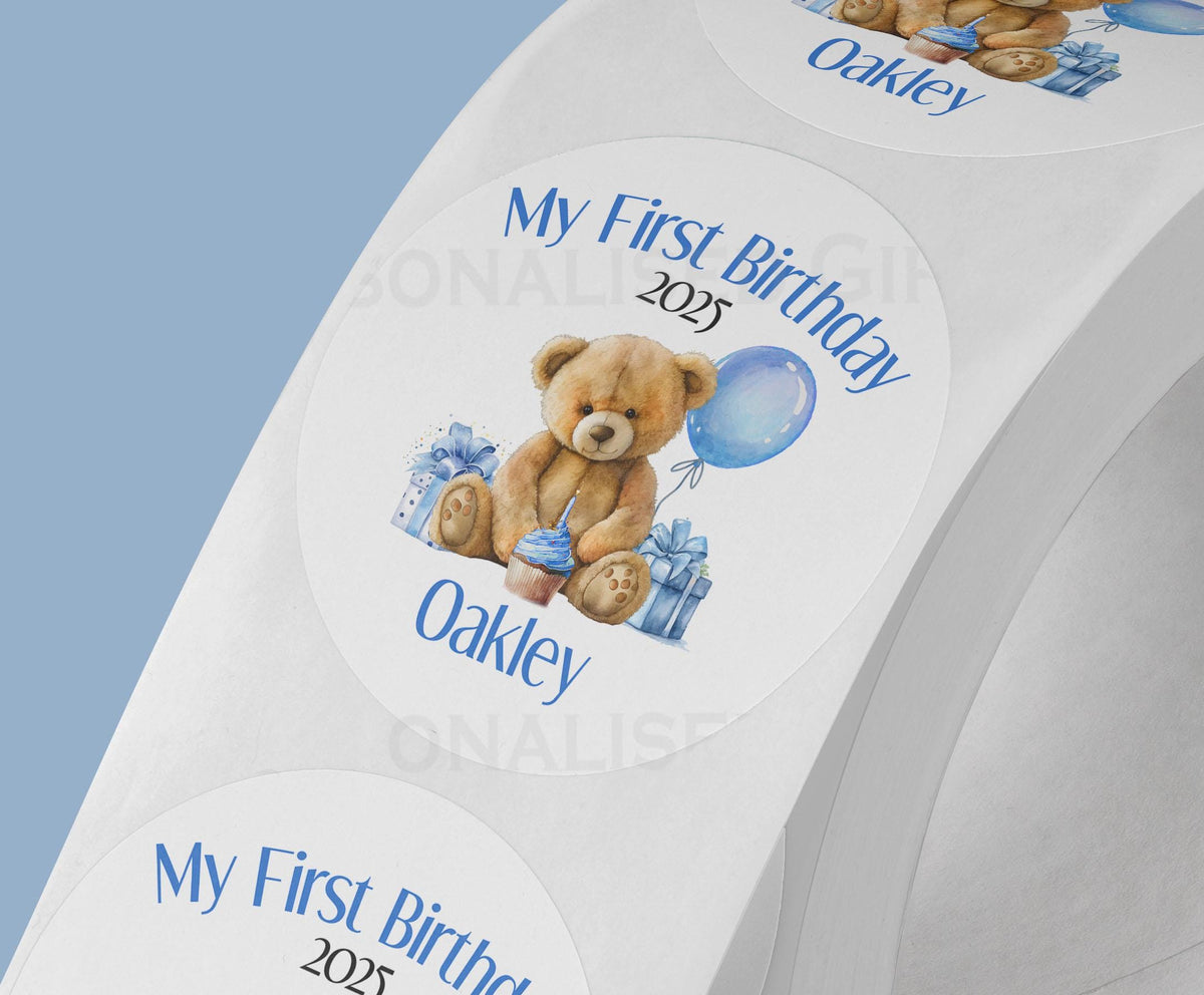 Personalised blue teddy bear first birthday stickers, glossy 5cm strips of three in a cello bag
