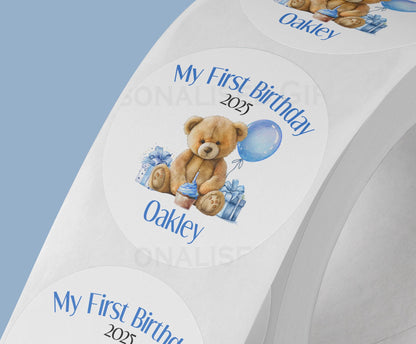 Personalised blue teddy bear first birthday stickers, glossy 5cm strips of three in a cello bag