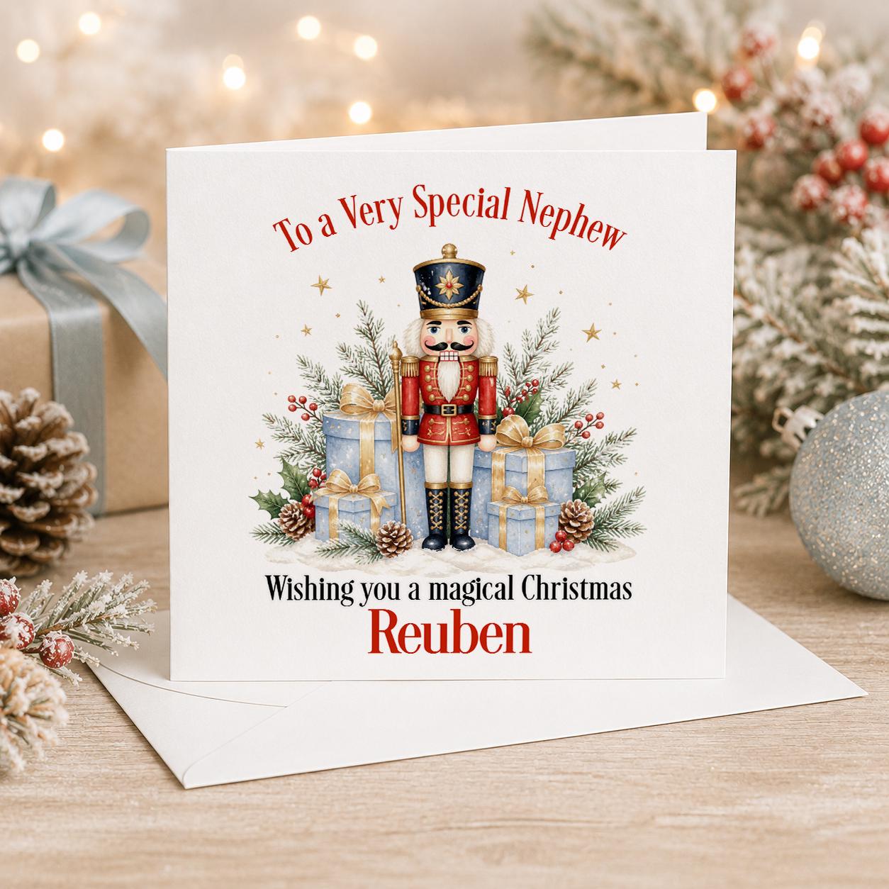 Personalised nutcracker Christmas card, white 6x6 inch square card printed with a red and gold nutcracker soldier and presents with a name
