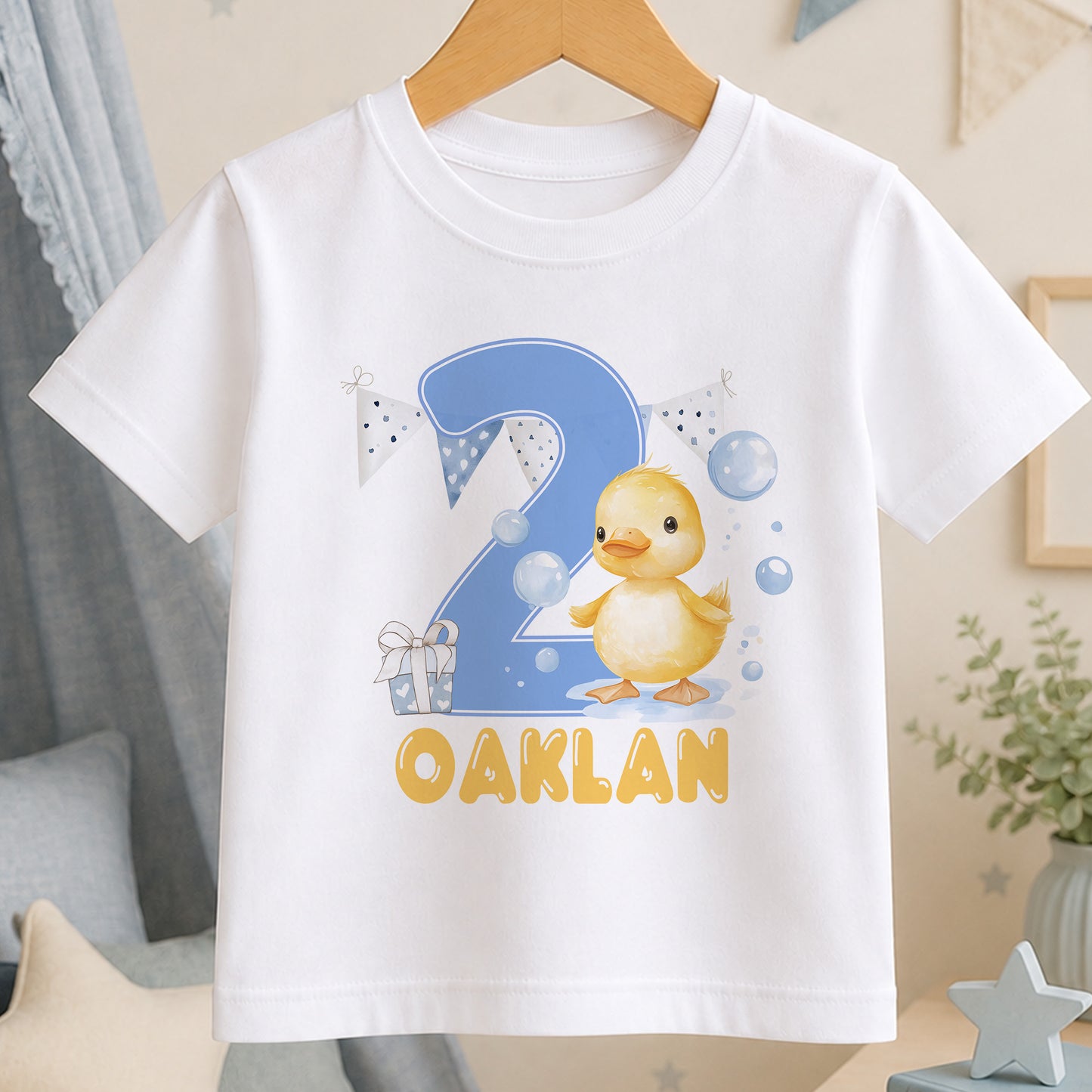 White age 2 birthday t-shirt printed with a yellow duck holding balloons and a personalised name