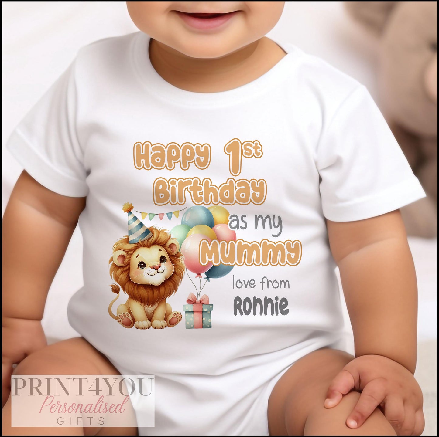 Close-up of the party lion, balloons and bunting design on the personalised 1st birthday bib.