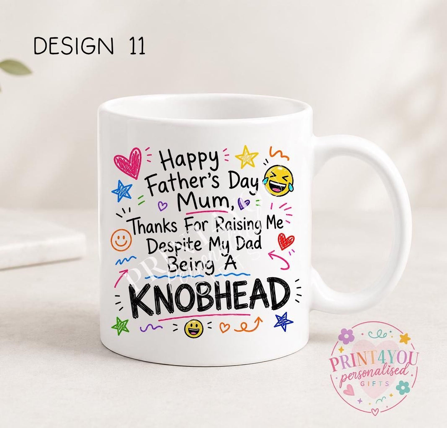 White ceramic mug printed with colourful hand-doodled text: Happy Father's Day Mum, thanks for raising me despite my dad being a knobhead (design 11)