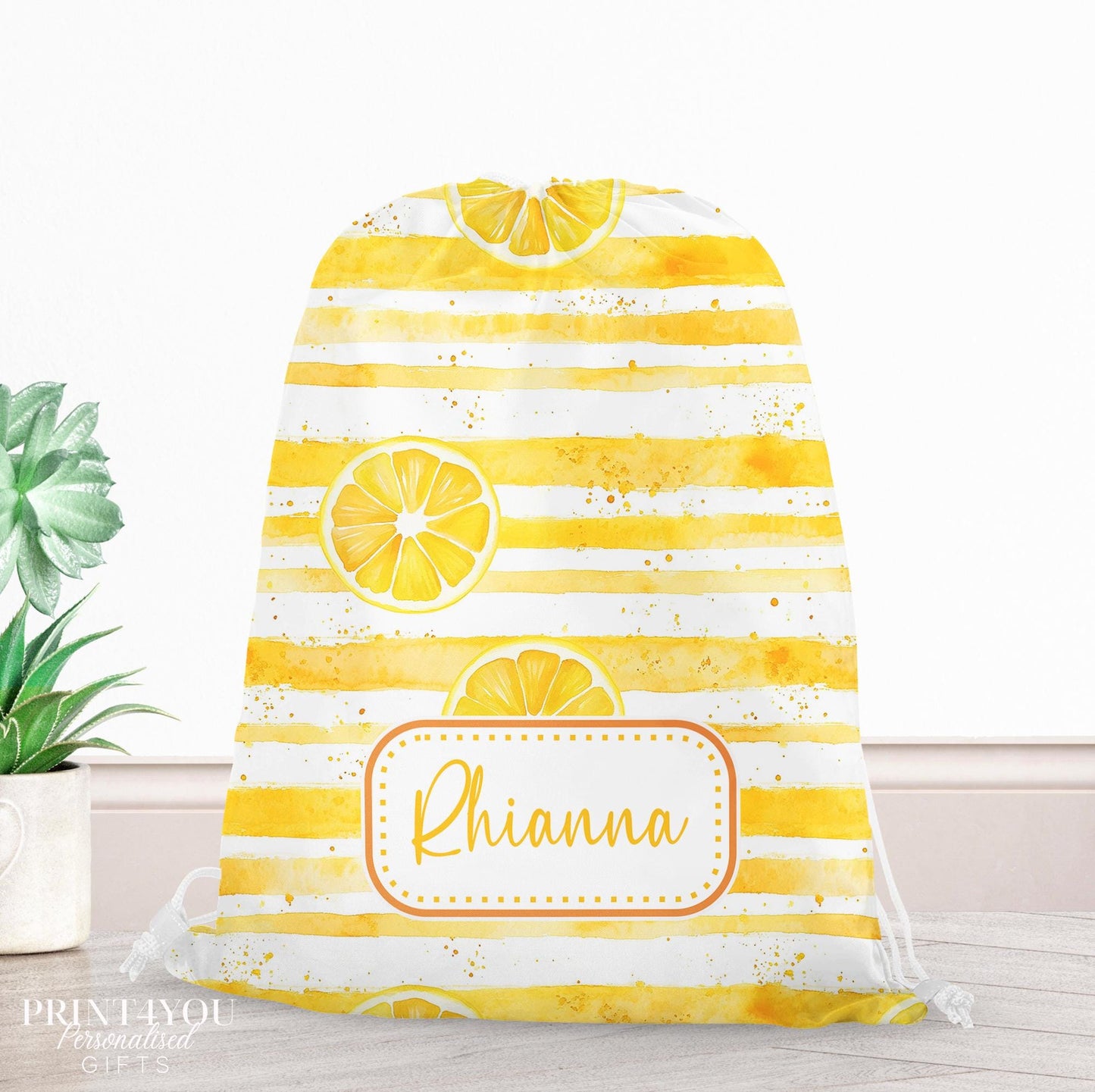 Yellow watercolour-striped drawstring PE bag printed with a lemon slice design, personalised with a child's name across the front