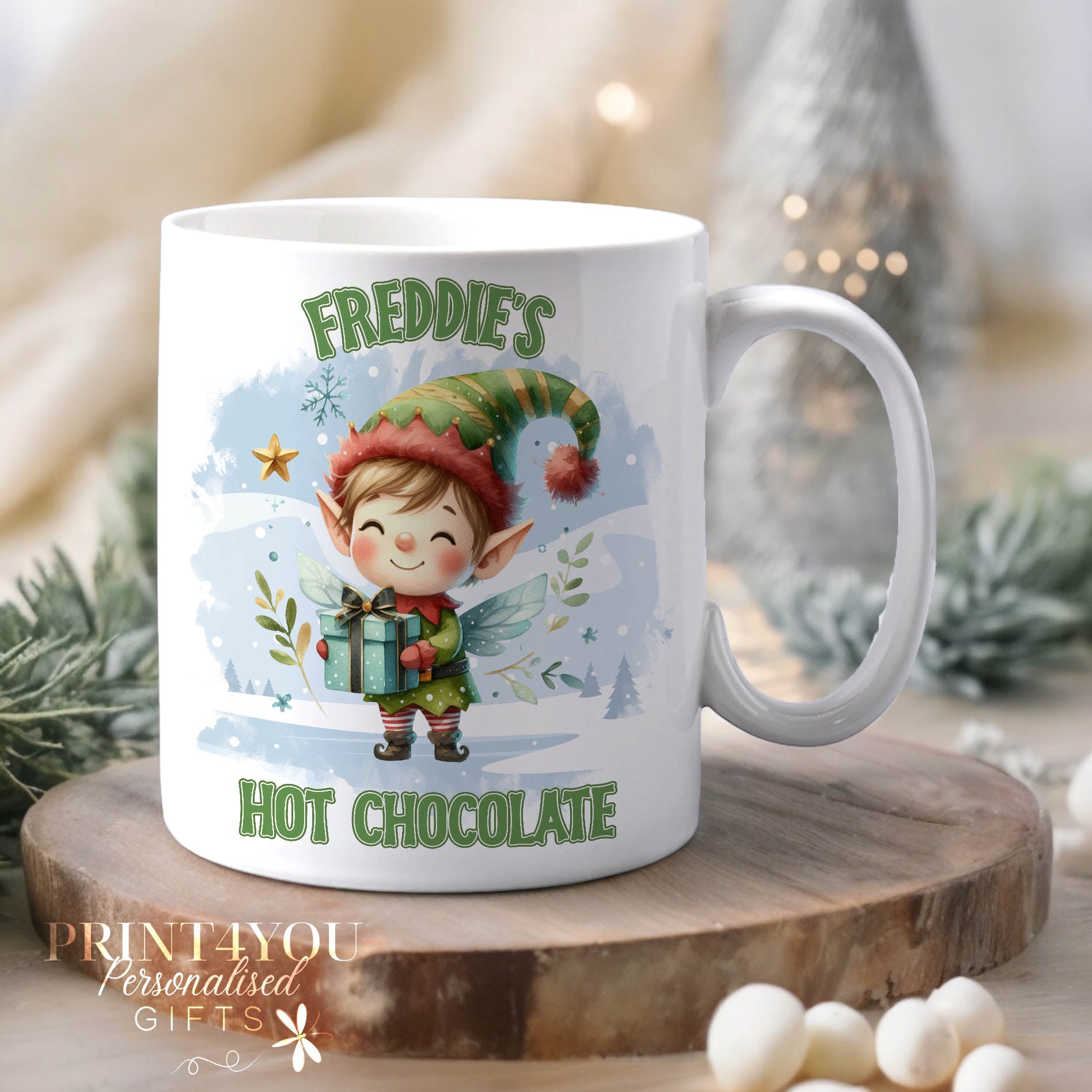 White ceramic mug personalised with a custom name, printed with a cheerful Elf Hot Chocolate Christmas design