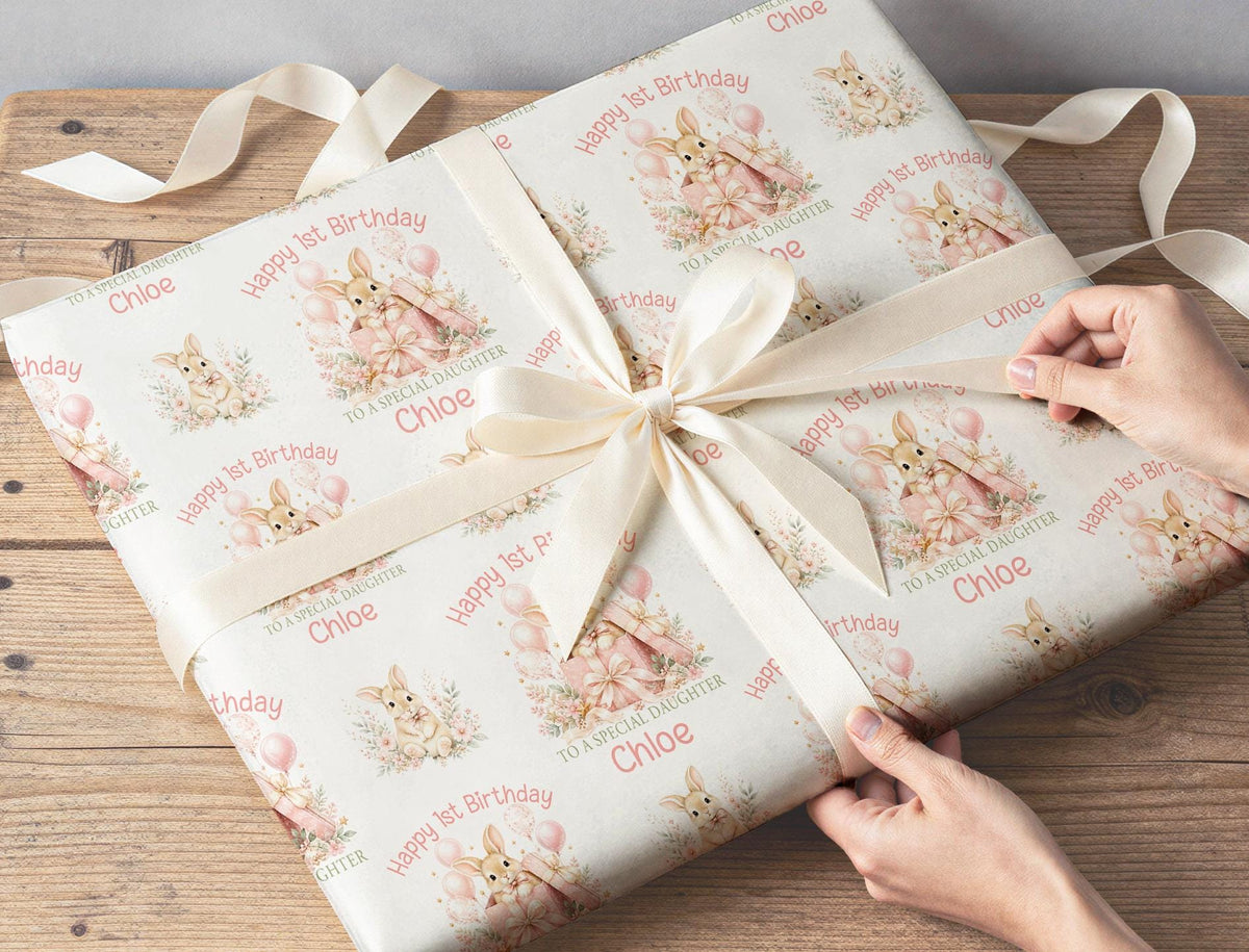 First birthday gift wrapped in personalised bunny rabbit pink floral wrapping paper with custom name