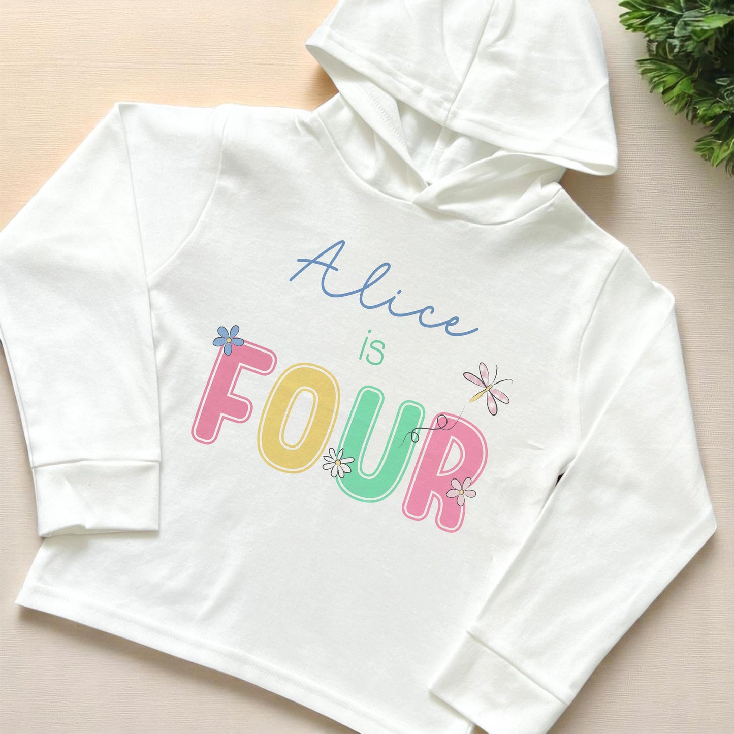 Birthday Pastel Daisy personalised long-sleeved hooded t-shirt in white jersey cotton, 6-12 months size, front view showing daisy birthday number design