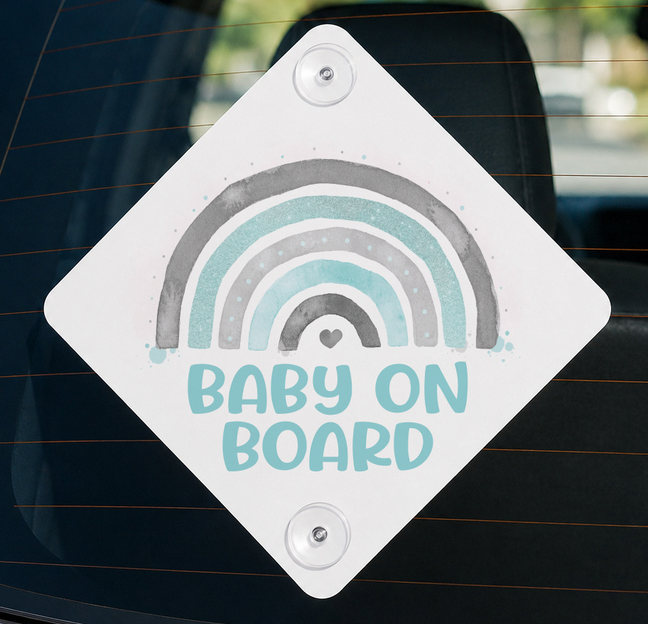 White diamond-shaped aluminium Baby on Board car window sign with an aqua, grey and rainbow design