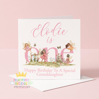Square personalised first birthday card featuring a pink woodland fairy design on a plain background