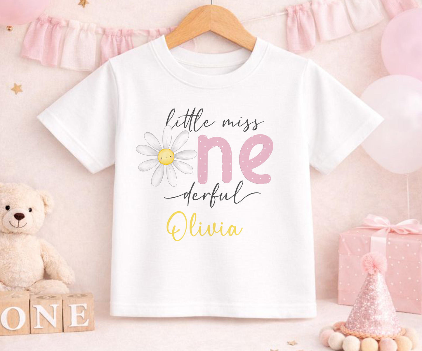 Personalised first birthday t-shirt with daisy party design and custom name, soft cotton.