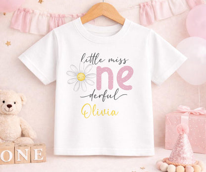 Personalised first birthday t-shirt with daisy party design and custom name, soft cotton.