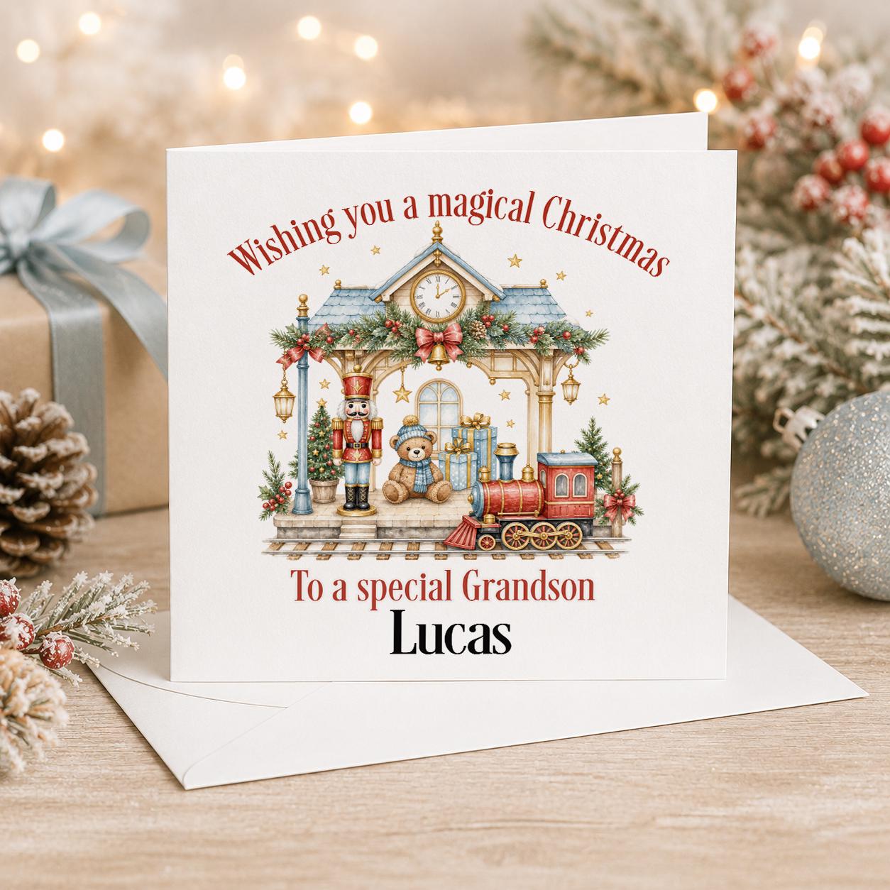 Personalised Christmas card, white 6x6 inch square card printed with a toy train station scene and a red steam train with a name