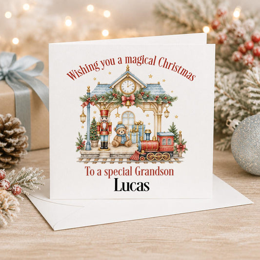 Personalised Christmas card, white 6x6 inch square card printed with a toy train station scene and a red steam train with a name