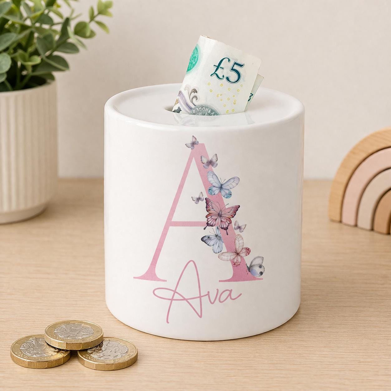 Glossy ceramic butterfly money box personalised with a child's name
