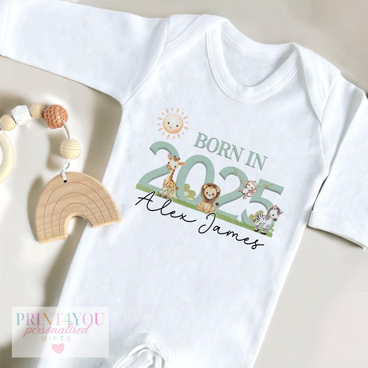 Personalised safari animal newborn vest, printed with baby's name and birth year.