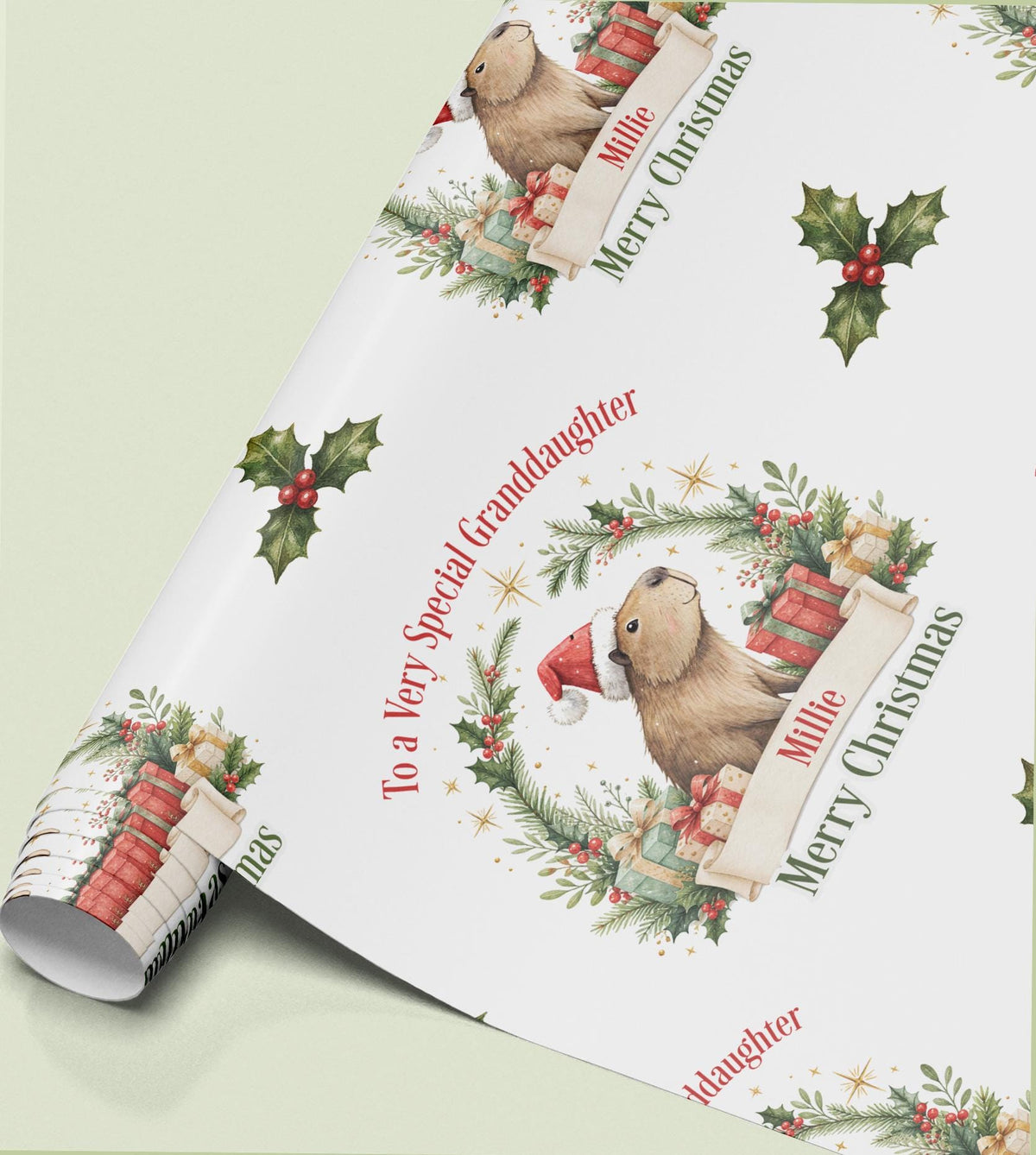 Rolled sheet of personalised Christmas wrapping paper with a holly wreath design and a name