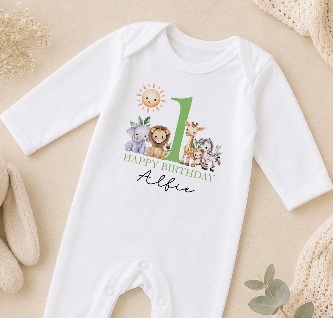 Personalised white baby vest printed with jungle animals and 'Happy Birthday Albie'.