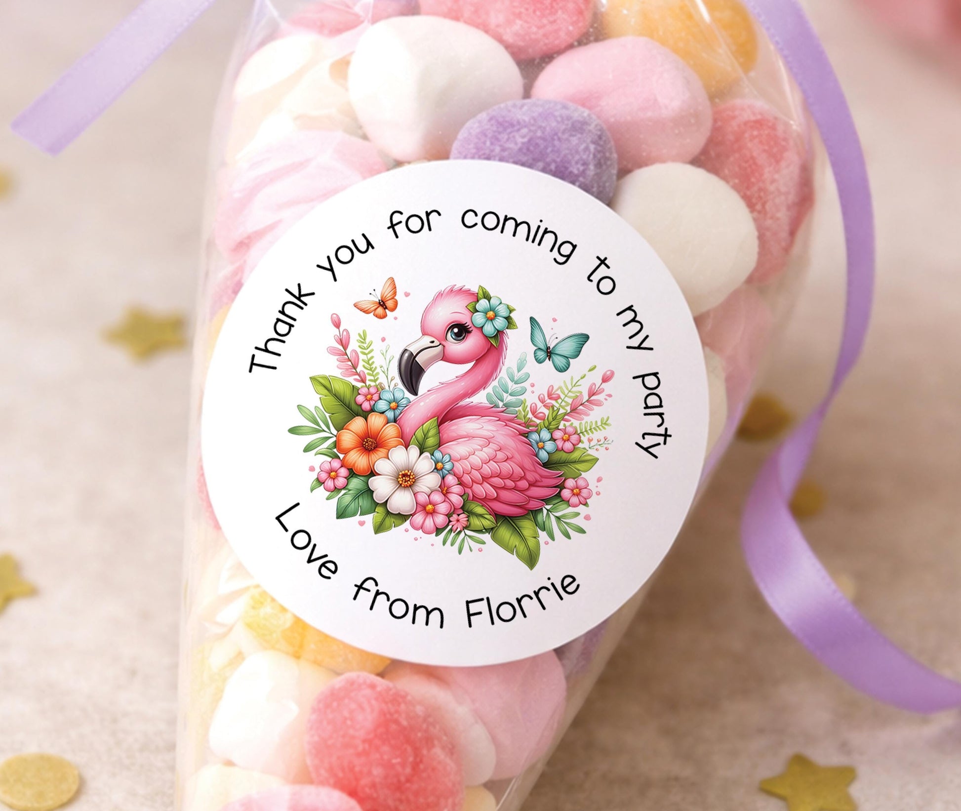 Round glossy pink flamingo thank you stickers printed with a child's name for party bag favours