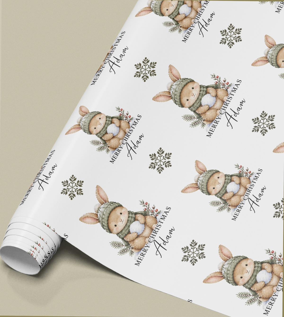 Close-up of the personalised bunny rabbit Christmas gift wrap pattern showing the custom name detail