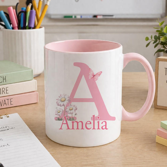 Personalised initial mug, ceramic mug with a pink handle printed with a large floral letter A and the name Amelia