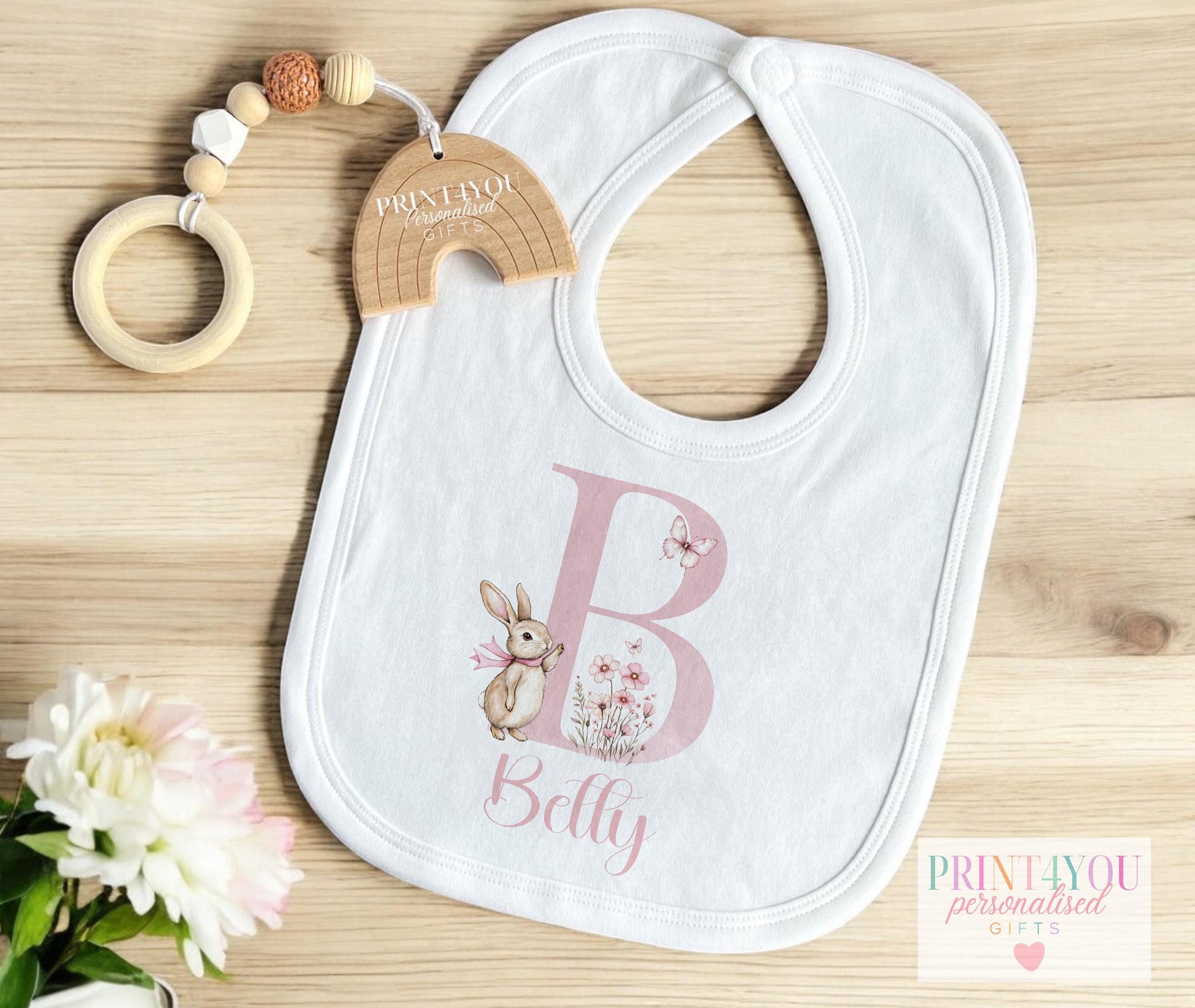 Personalised floral bunny t-shirt, printed with the baby's name for a new baby gift.