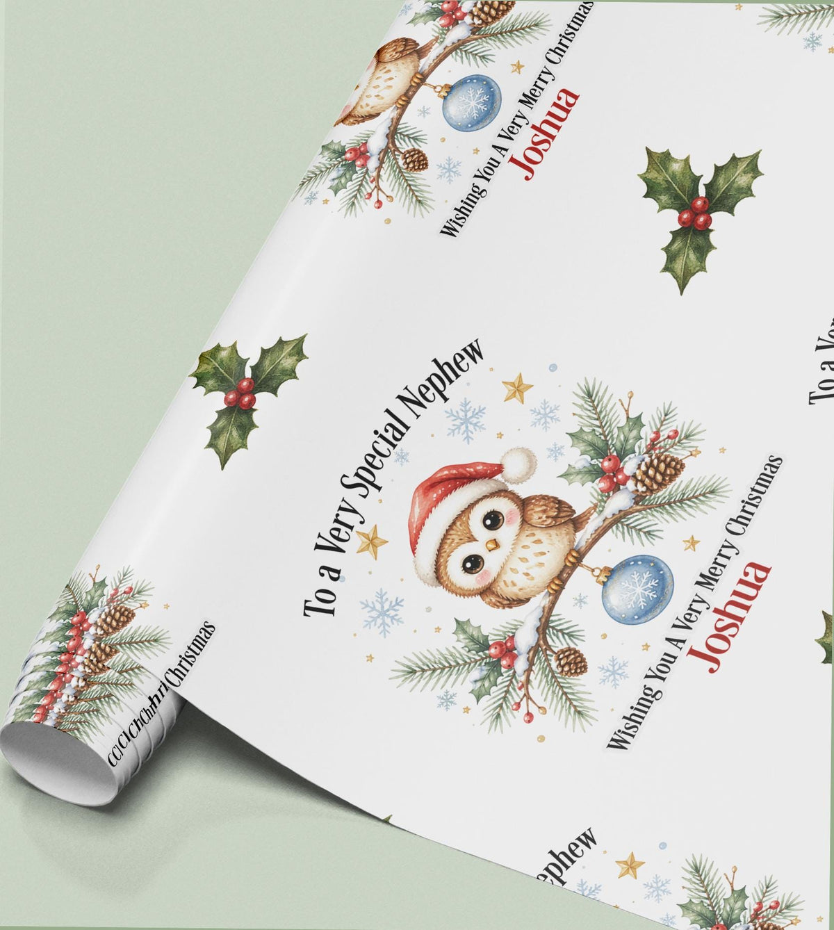 Rolled sheet of personalised owl Christmas wrapping paper printed with a name and relation