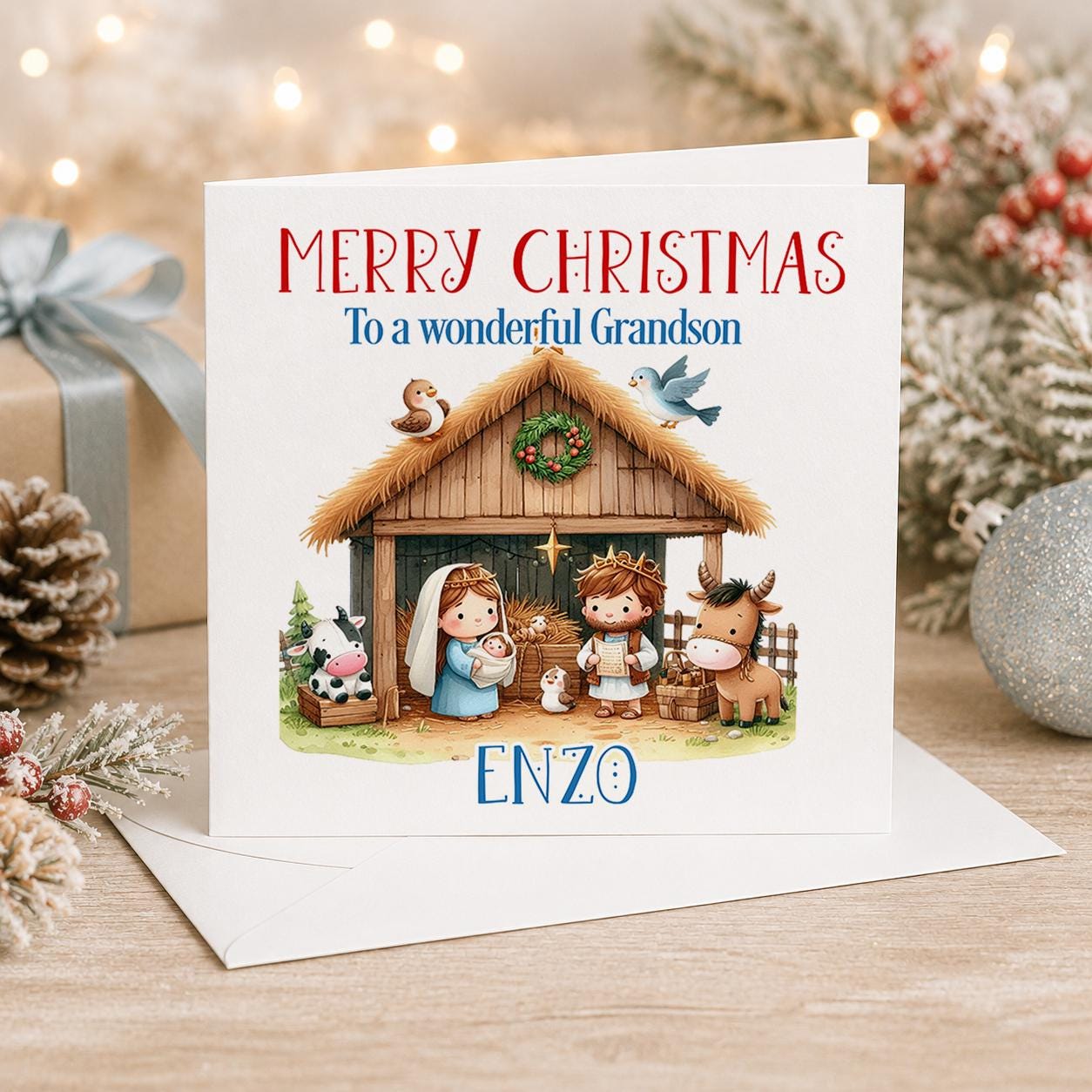 Personalised nativity Christmas card, white 6x6 inch square card printed with Mary, Joseph and the manger in a stable with a name