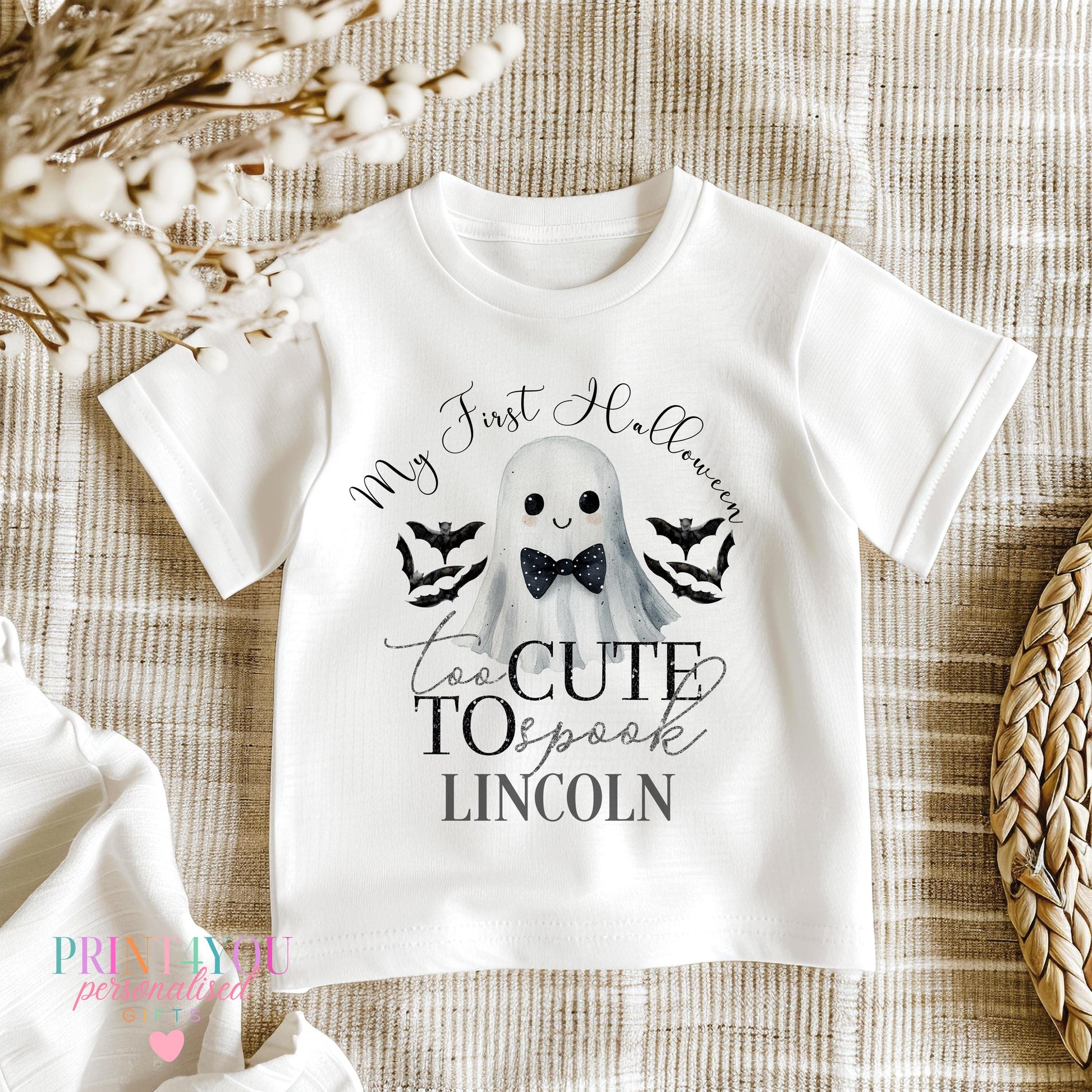 Personalised Halloween baby bib with bow-tie ghost and bats design and baby's name.