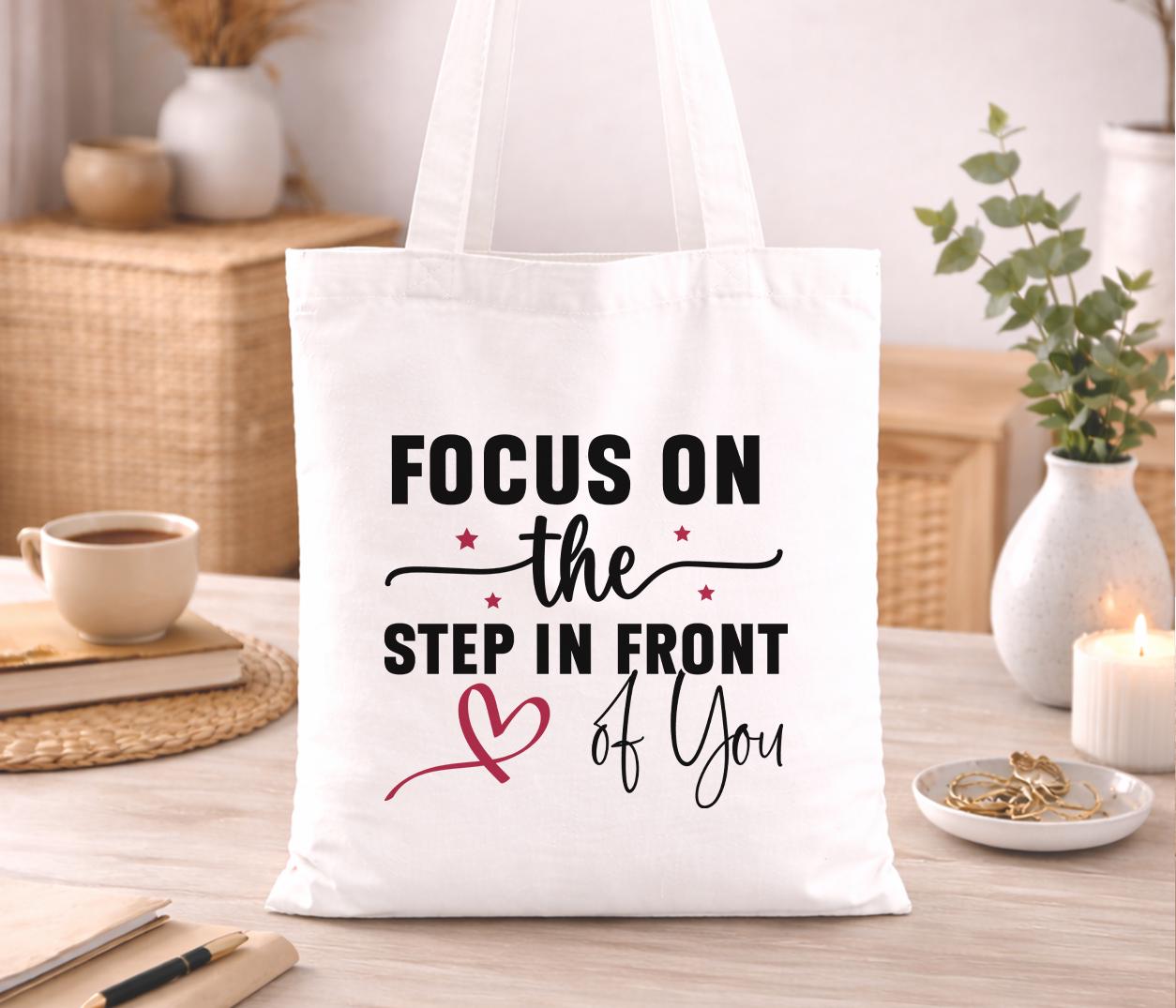 Cotton tote bag printed with a bold motivational quote in a clean typeface